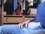 Jerking off sitting on a chair in a dressing room