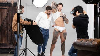 When the photographer calls a break, he sneaks up and sucks the model's cock