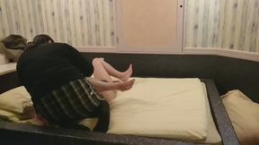 A plump woman makes a man get on all fours and touches him a lot with her hands and feet