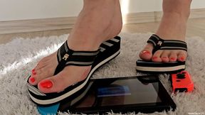 Trampling Nintendo Switch in Striped Sandals