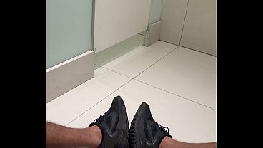Big, hairy, very hard penis on the bathroom floor of the shopping mall.