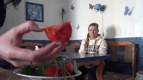 girl with vegetables pinching nose Fso