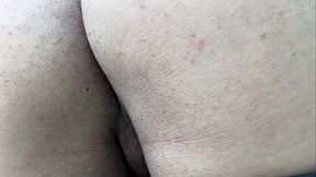 A macabre giant demon showers in front of a tiny human.