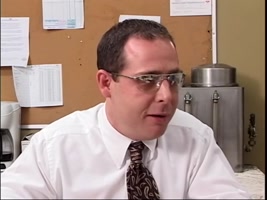 Glasses-Wearing Brunette Gets Double Teamed by Two Suited Coworkers and a Facial