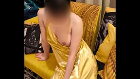 Asian girl in sexy gold camisole and miniskirt