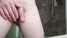 Pissing in the shower and playing with the hairy cock