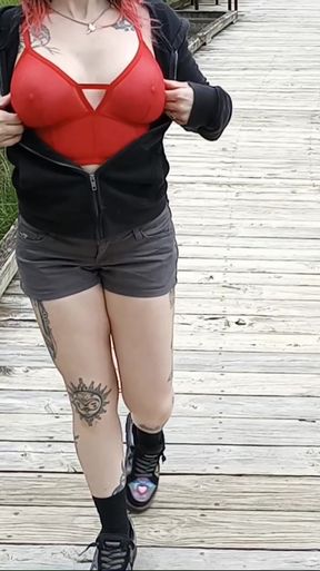 Curvy braless redhead takes advantage of public outdoor setting
