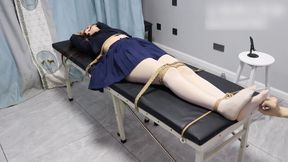 GG133-An Asian girl in white socks, bound to the bed with ropes, gagged with a gag, and having her feet tickled.