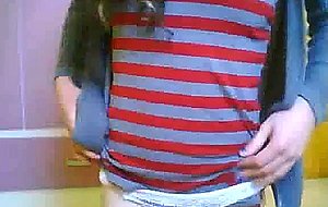Cute teen ts does a little softcore posing for the cam