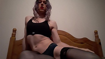Horny Transvestite sucking and playing with a dildo