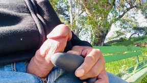 Cumshot with vibrator on the park bench