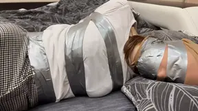 Silver tape bondage in tights and skirt