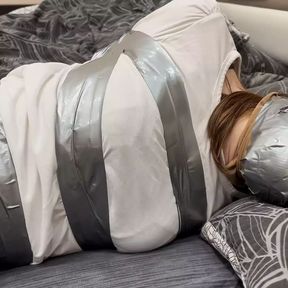 Silver tape bondage in tights and skirt