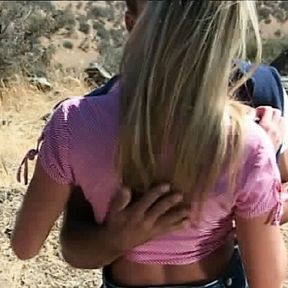 Muscled man gets frisky with hot girl in a desert