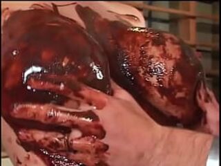 Breasty golden-haired enjoys sex with chocolate on her large breasts