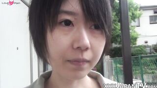 Young Japanese woman shows off butt and twat