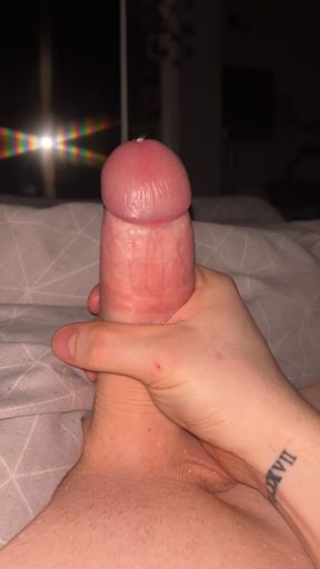 Young guy plays with his big dick