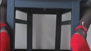 Sitting in heels and lingerie on a chair