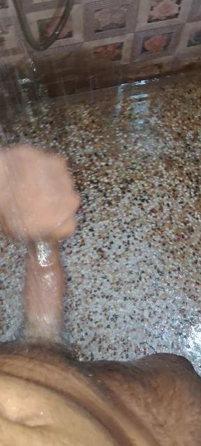 A Young Hindu Boy From India Is Fucking His Thick Cock Hard with His Hands While Taking a Bath