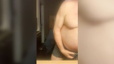 Chubby older guy with glasses strips and strokes his cock