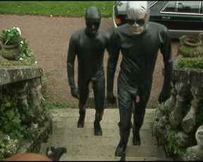 Masked German dominas having fun with their male servant