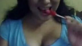 Slutty webcam brunette sucked lollipop and flashed her boobies