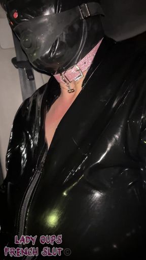 Submissive Whore in Latex with Hood and Gag in Car Exhibited