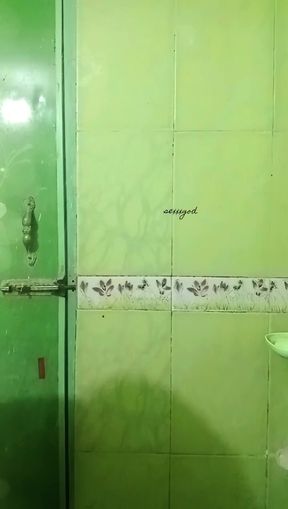 Bangladeshi petite babe shows off her natural tits in a homemade shower scene