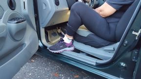 Diana Senior pedal pumping her car in socks and sneakers