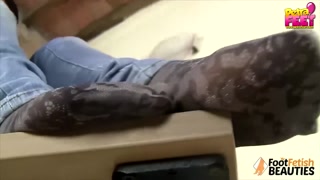 Petra takes off ballet flats and socks to show you her feet