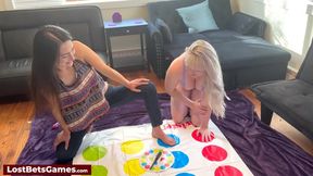 Lesbian twist in a twister game as they both strip down together