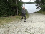 wetsuited silicone masked man on patrol near lake