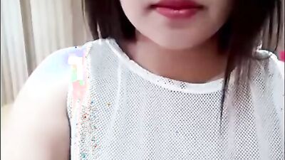 Asian teen chick is teasing and giving JOI via web camera