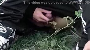 A cute gay Asian guy masturbates and comes outdoors, then cleans up