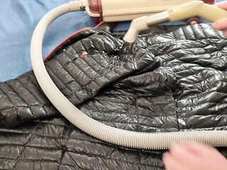 Vacuuming Darksome Shark Ghost Whisperer Down Jacket with Vintage Electrolux Vacuum Cleaner