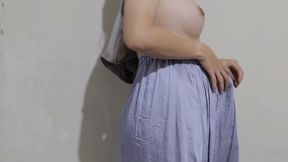 Indonesian girl tries on the latest satin skirt while dancing and showing off her body