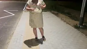 Hot milf shows off big booty and tits in public strip show