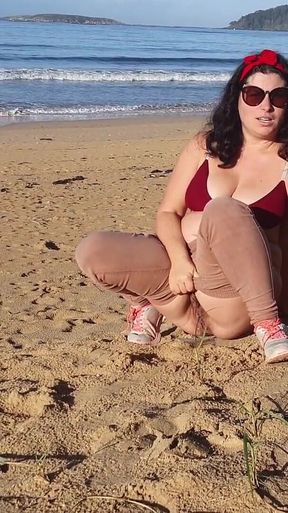 Woman Pissing on a Public Beach While No One Is There