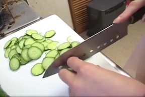 Insatiable Young Wife Drenches Cucumber Deep in Kitchen Sink