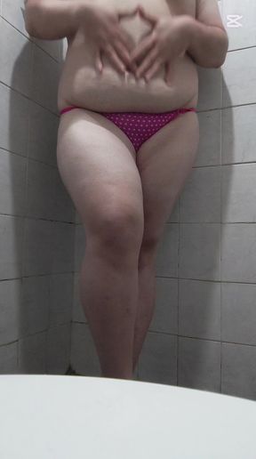 Playing alone in a thong and