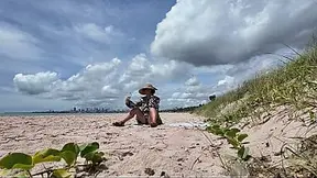 Curvy MILF exposes hairy snatch at public beach