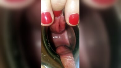 Blonde explores her pussy with a speculum and silicone toys in intimate close-up