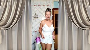 Mature housewife Lukerya twerks her curvy figure in white shorts in the kitchen, hot flirting and teasing movements