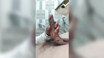 Indian guy with big uncut cock shoots cum in public toilet