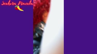 Senhora Pimenta does a Striptease while sensually smoking a cigar.