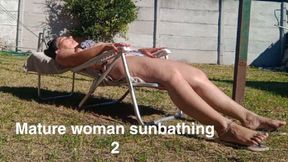 Mature woman sunbathing 2