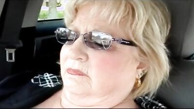 Slutty granny loves to masturbate and flash her big tits in public