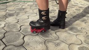 Crushed a toy car with black boots C