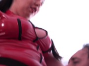 Femdom. Two dominatrixes in latex pegging their sissies in the mouth.