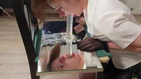 ritzy rain takes a deepthroat exam on top of mirror and gets throat fucked with o-ring mouth gag